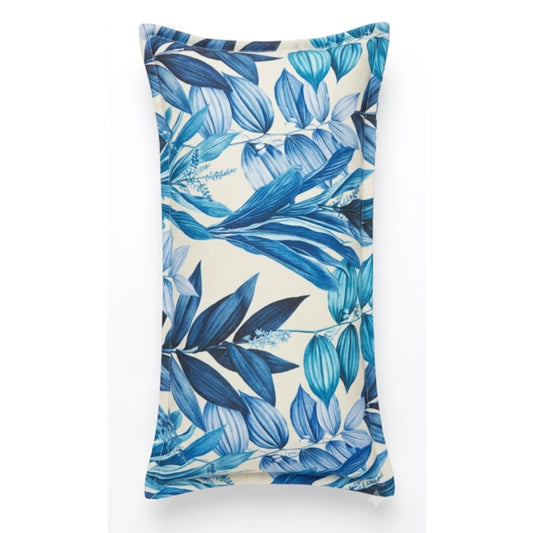 A rectangular lumbar pillow featuring a blue tropical leaf pattern on a cream background, shown against a plain white studio backdrop.