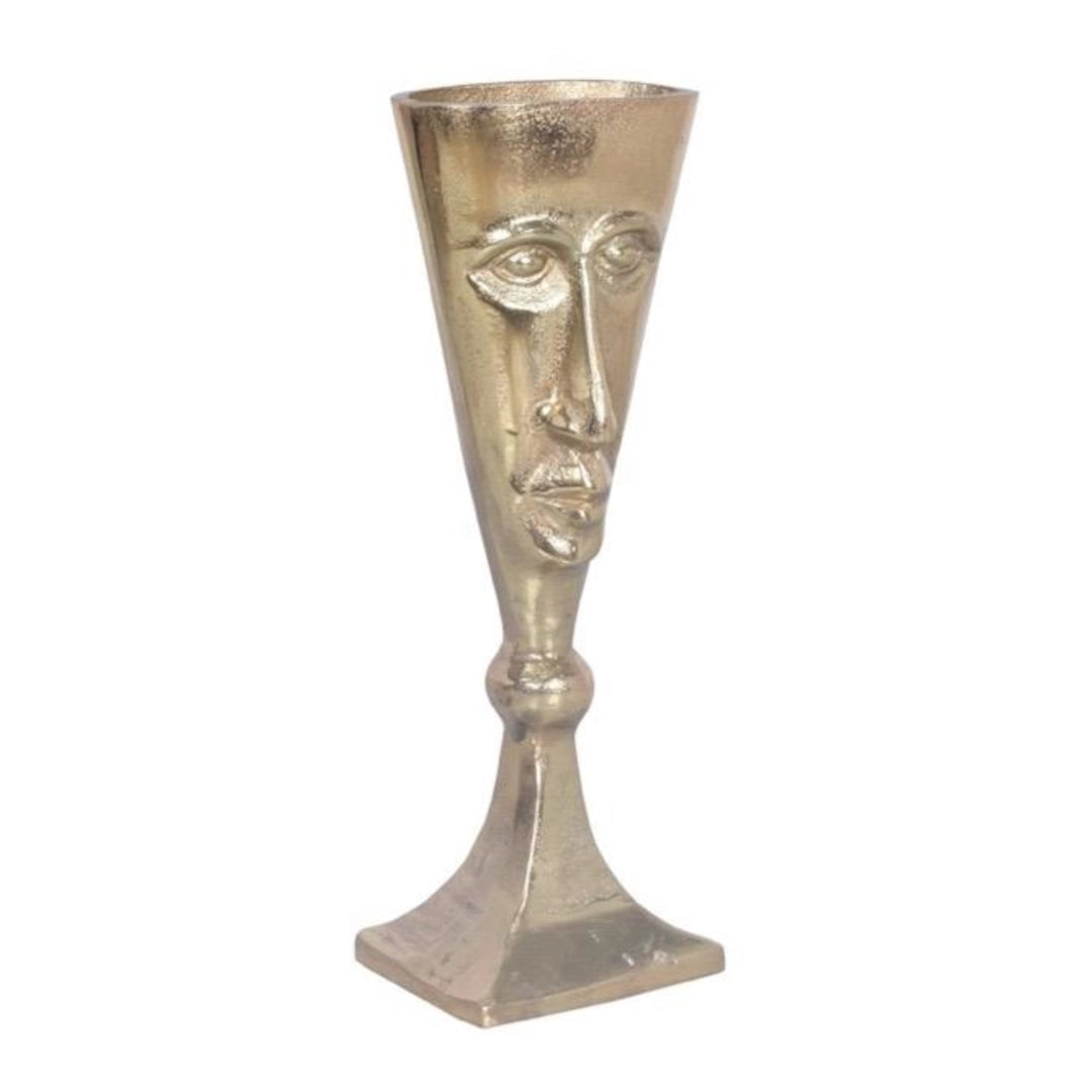 A gold coloured Vase with a face visage on a white background
