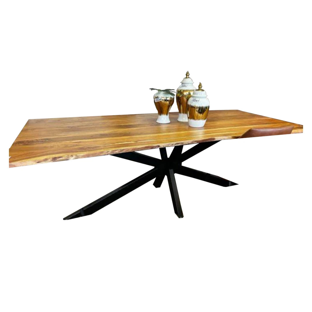 Wooden dining table with black metal legs on a white background
