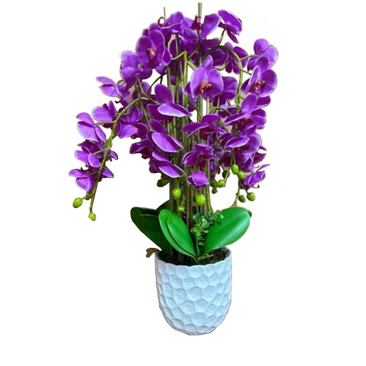 A White plant pot with a Purple Orchid plastic plant
