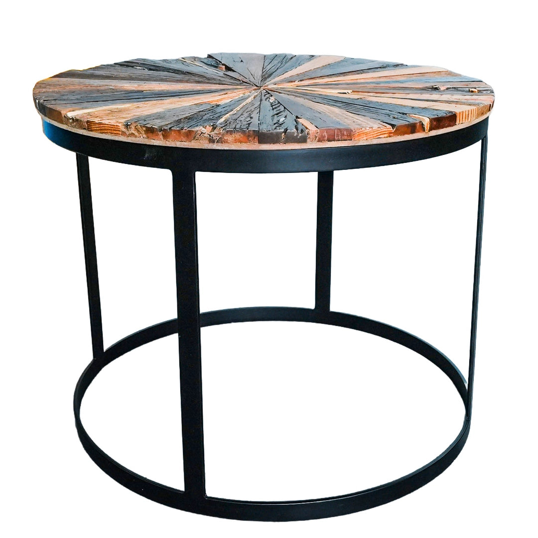 A wooden patterned coffee table on a black metallic stand