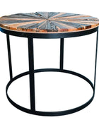 A wooden patterned coffee table on a black metallic stand
