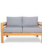 Classic outdoor two seater cedarwood couch with navy & white striped canvas cushions