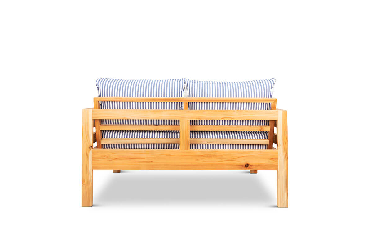 Classic outdoor two seater cedarwood couch with navy & white striped canvas cushions