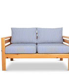 Classic outdoor two seater cedarwood couch with navy & white striped canvas cushions